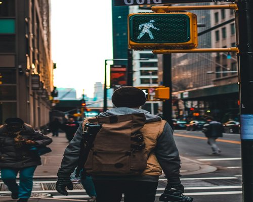 person walking on a quiet urban street